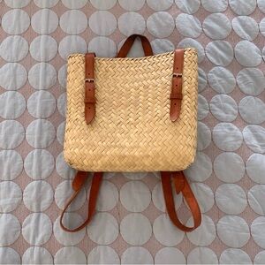Hand woven straw backpack with leather straps
